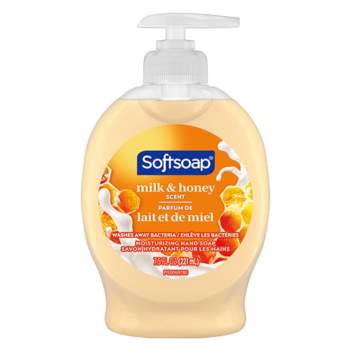 Front view of a Softsoap Milk and Honey moisturizing liquid hand soap bottle, featuring an orange label with graphics of swirling milk and honeycomb.