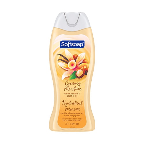 Une vue frontale haute résolution du flacon de gel douche hydratant Softsoap « Warm Vanilla & Jojoba Oil ». L'étiquette arbore un motif doré tourbillonnant, orné de fleurs de vanille et de noix de jojoba, et le désigne comme « Creamy Moisture ».