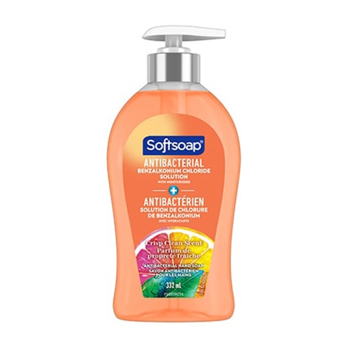 Avant de la pompe Softsoap antibactérien, bouteille orange avec agrumes et texte bilingue.