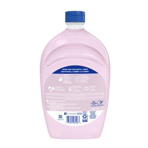 Dos de la recharge Softsoap noix de coco et d’hibiscus, grande bouteille rose au bouchon bleu.
