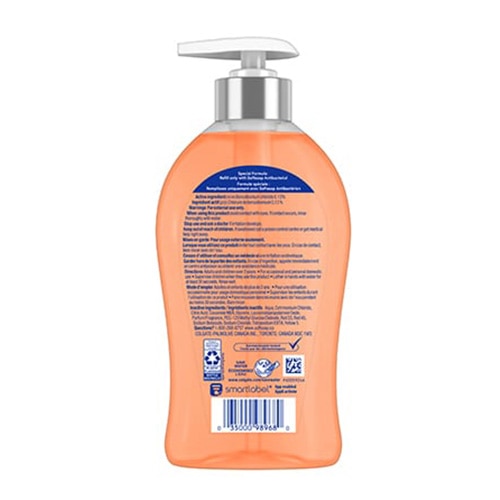 Dos de la pompe Softsoap antibactérien, bouteille orange 332 mL avec texte des ingrédients.